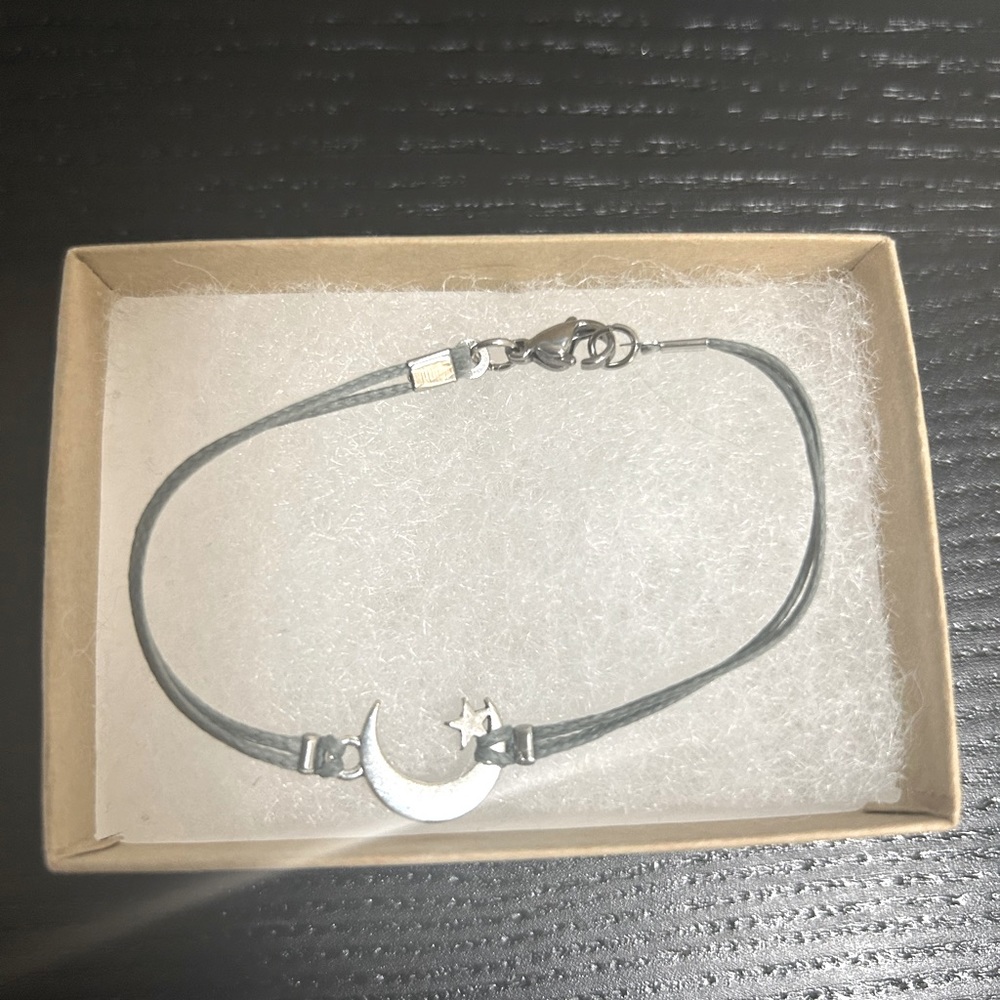 Silver crescent moon cord bracelet